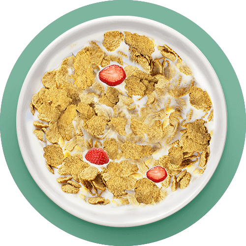 Bowl of Kellogg's Corn Flakes with Milk and Strawberries slices