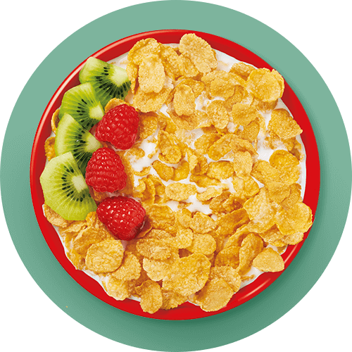 A bowl of Corn Flakes With Strawberries, Kiwi and Milk