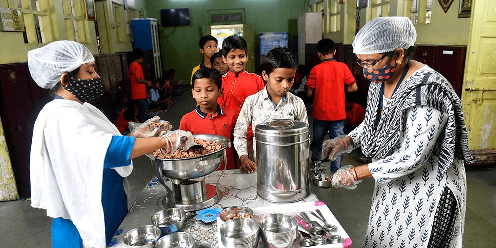 Serving Children a bowl of Kellogg's Chocos with milk